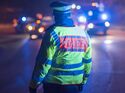 Police officer regulates traffic in a traffic accident, Stuttgart, Germany