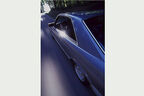 Seitenansicht von schräg hinten eines Mercedes-Benz 380 SEC in Fahrt